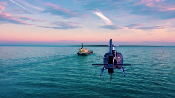 Helicopter Flying Over The Sea