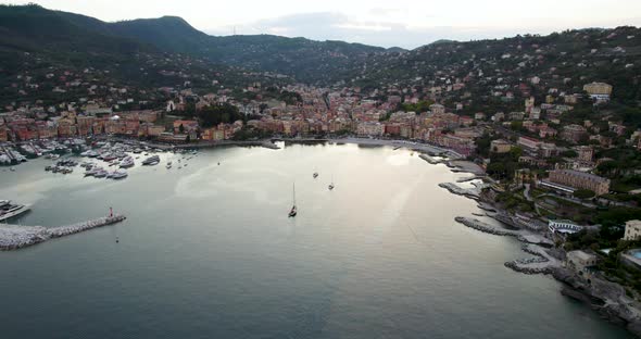 Gorgeous coastal town and marina on Riviera di Levante, Italy; aerial arc