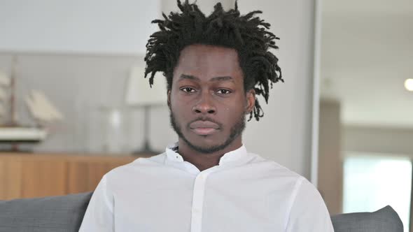 Portrait of Young African Man Looking at the Camera 