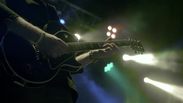 Silhouette of Guitar Player on Stage