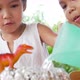 Two girls do volcano experiment at their house - VideoHive Item for Sale