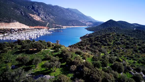 The top view from the drone of Kas resorts, bay with yahts and city in Mugla province of Turkey