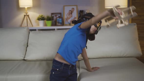 Little Girl Child Child Plays In A Helmet And Glasses