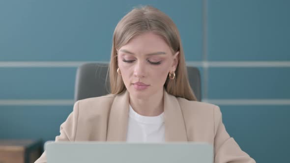 Close Up of Businesswoman Working on Laptop in Office