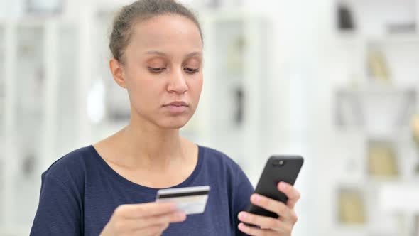 Portrait of African Woman Making Successful Online Payment on Smartphone