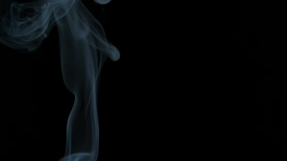 White vapor on the black background indoor.