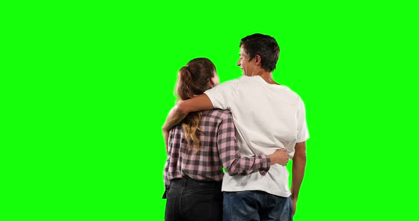 Rear view of a couple with green screen