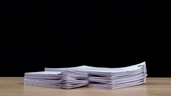 Stop motion animation Stacks overload document paper files on office desk