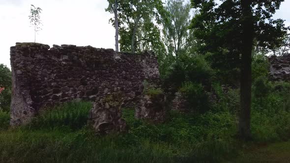 Medieval Castle Ruins in Latvia Rauna. Aerial View Over Old Stoune Brick Wall of Raunas Castle 