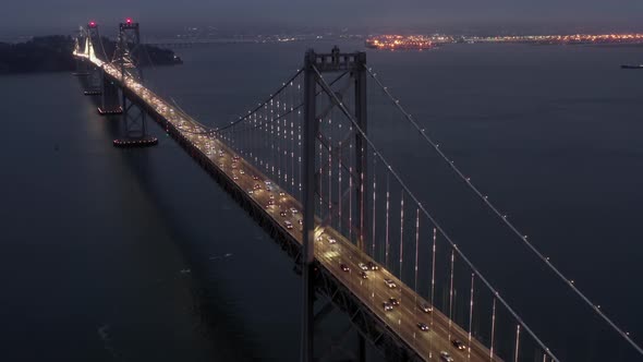 Scenic Aerial of Traffic on Cable-stayed Bay Bridge.  Night City Illumination