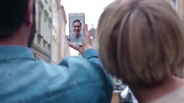 Video communication. Closeup couple using phone for video call