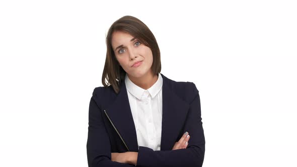 Portrait of Sarcastic Young Businesswoman Wearing White Blouse and Black Jacket Standing with Arms