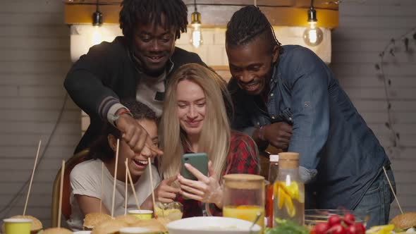 Joyful Positive Multiracial Friends Surfing Social Media Talking Laughing in Slow Motion