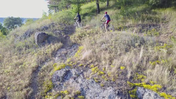 Riding on a Bike on Forest Path