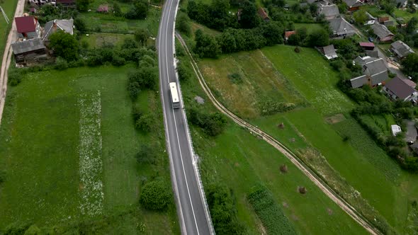 Aerial View of Bus Moving By Mountain Road