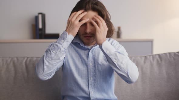 Emotional Man Talking to Camera Complaining About His Life Feeling Stressed and Desperate Sitting on