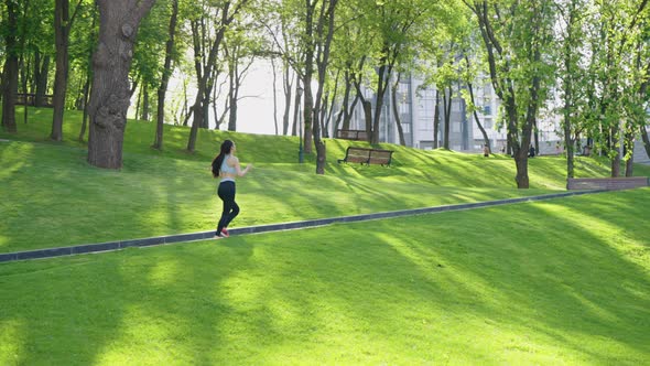 Female Jogger in Green Park