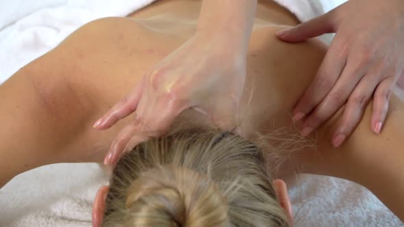 Woman Gets Neck and Head Massage and in Luxury Spa