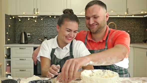 Nice Married Couple is Preparing Something in the Kitchen