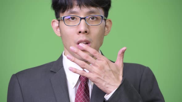 Young Asian Businessman Shocked