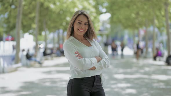 Beautiful Happy Young Woman Posing on Street