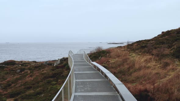 Tourist Sites Along Atlantic Road Coastline With Pedestrian Walkways In Norway. Aerial Tracking