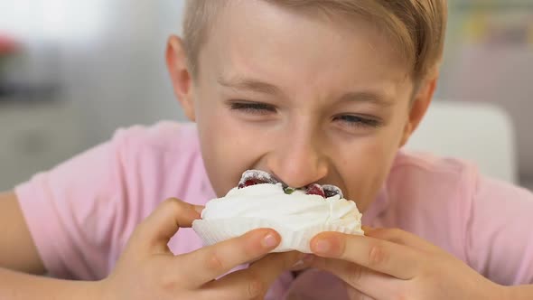 Happy Boy Eating Tasty Cream Cake, Unhealthy Nutrition, Caries Risk, Close Up