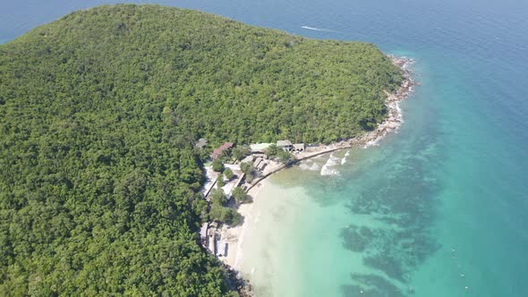 Aerial view of Koh Larn beach, Pattaya with blue turquoise seawater, mountain hills