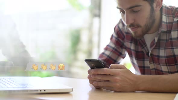 Young man chatting on smartphone