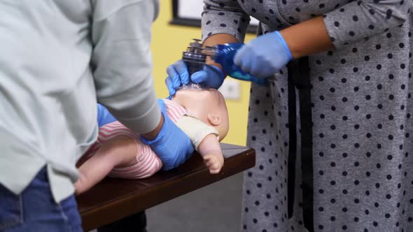 Medical mannequin doll for emergency aid. Training for giving first aid to a toddler. 