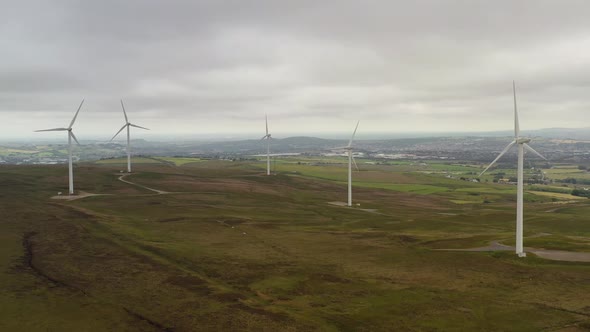 A group of wind turbines on a hill