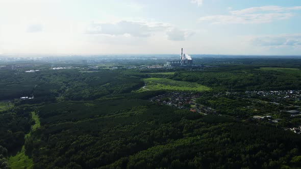 Thermal Power Plant on the Background of a Summer Blue Sky