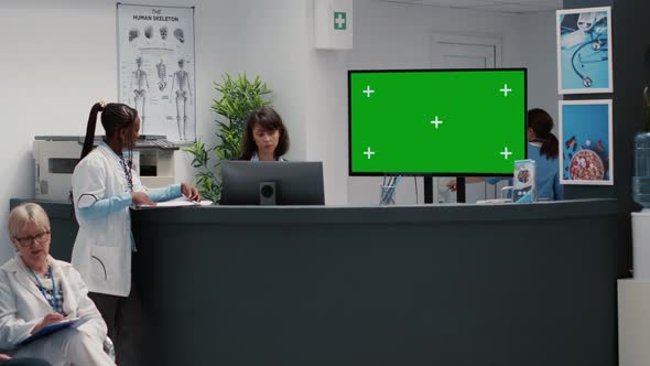 Hospital Reception Desk with Greenscreen on Tv Monitor