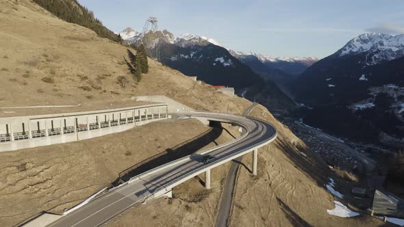 Aerial view of a road crossing the mountain in wintertime in Ticino, Switzerland.