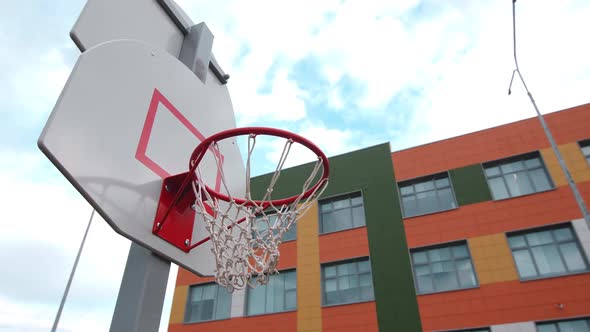 New Basketball Shield with Net on Sportsground Near Building