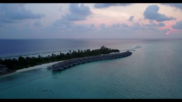 Aerial seascape of perfect lagoon beach adventure by aqua blue lagoon with white sandy background of