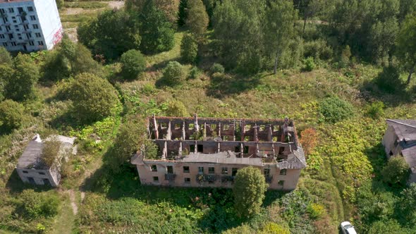 Aerial View of Abandoned and Destroyed Buildings From the Times of the USSR in a Green Picturesque