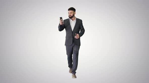 Businessman Walking and Making a Video Call on Gradient Background