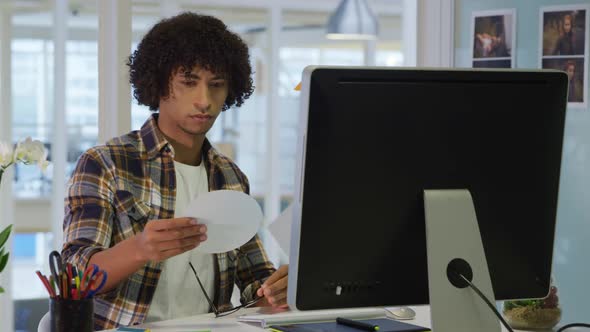 Young man working in a creative office