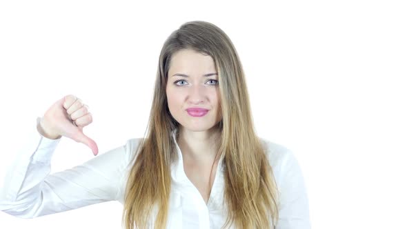 Thumbs Down By Beautiful Young  Woman, White Background