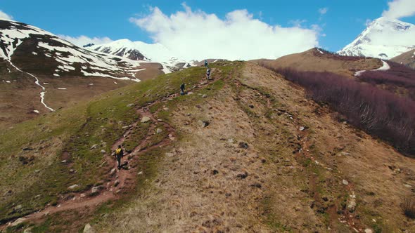 Aerial View of People Walking on the Top of the Hill in Kazbegi Georgia