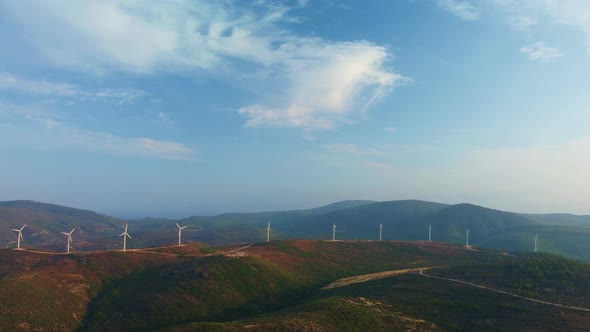 Drone Flies Over a Windmill Park