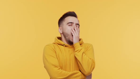 Expressive young man screaming and shouting over vibrant background.