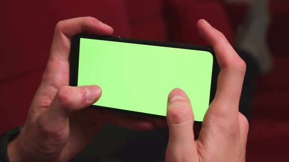 Close Up Man Hands Holding Chromakey Green Screen Smartphone Watching Content Play Game Swiping