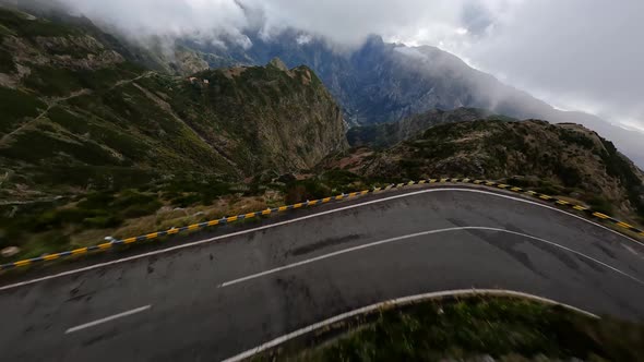 Mountain Surfing Flying and Diving Along High Cliffs and Rocks Into a Valley