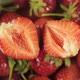 Sliced Strawberry On The Background Of A Rotating Berry. - VideoHive Item for Sale