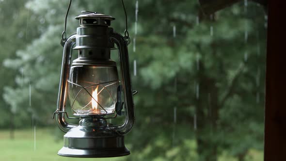 Rain Water Dipping from the Roof Edge with Old Oil Lantern