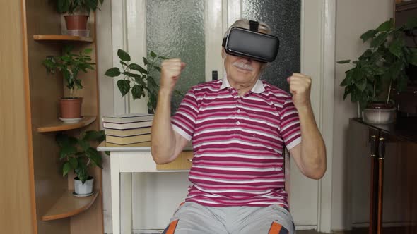 Senior Grandfather in Virtual Headset Glasses Watching Video in 3D Vr Helmet and Dancing, Having Fun