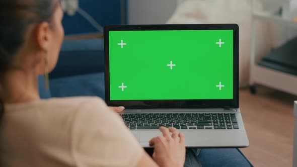 Close Up of Freelencer Using Laptop Computer with Mock Up Green Screen Chroma Key Display