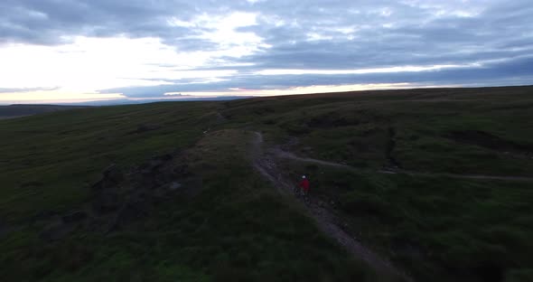 Aerial shot of a mountain biker on a singletrack trail